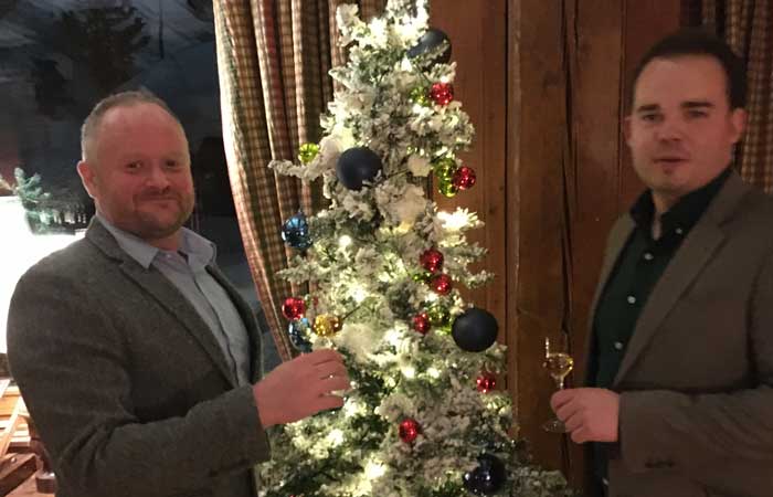 Andy and Joel by the Christmas tree at The Hermitage