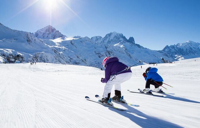 family skiing italy