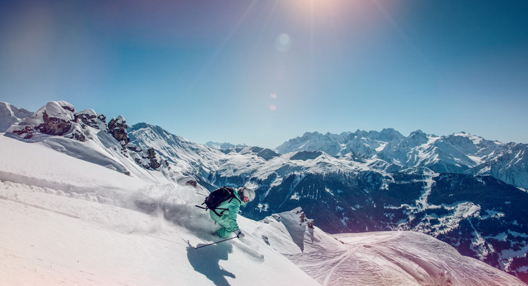 A skier in the mountains of Val d'Anniviers