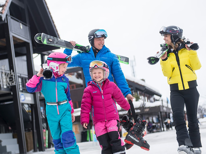 A happy family on their way to the slopes